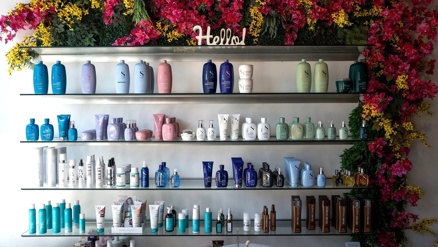 The retail shelf at House of Excellence 201, stocked with professional hair care products